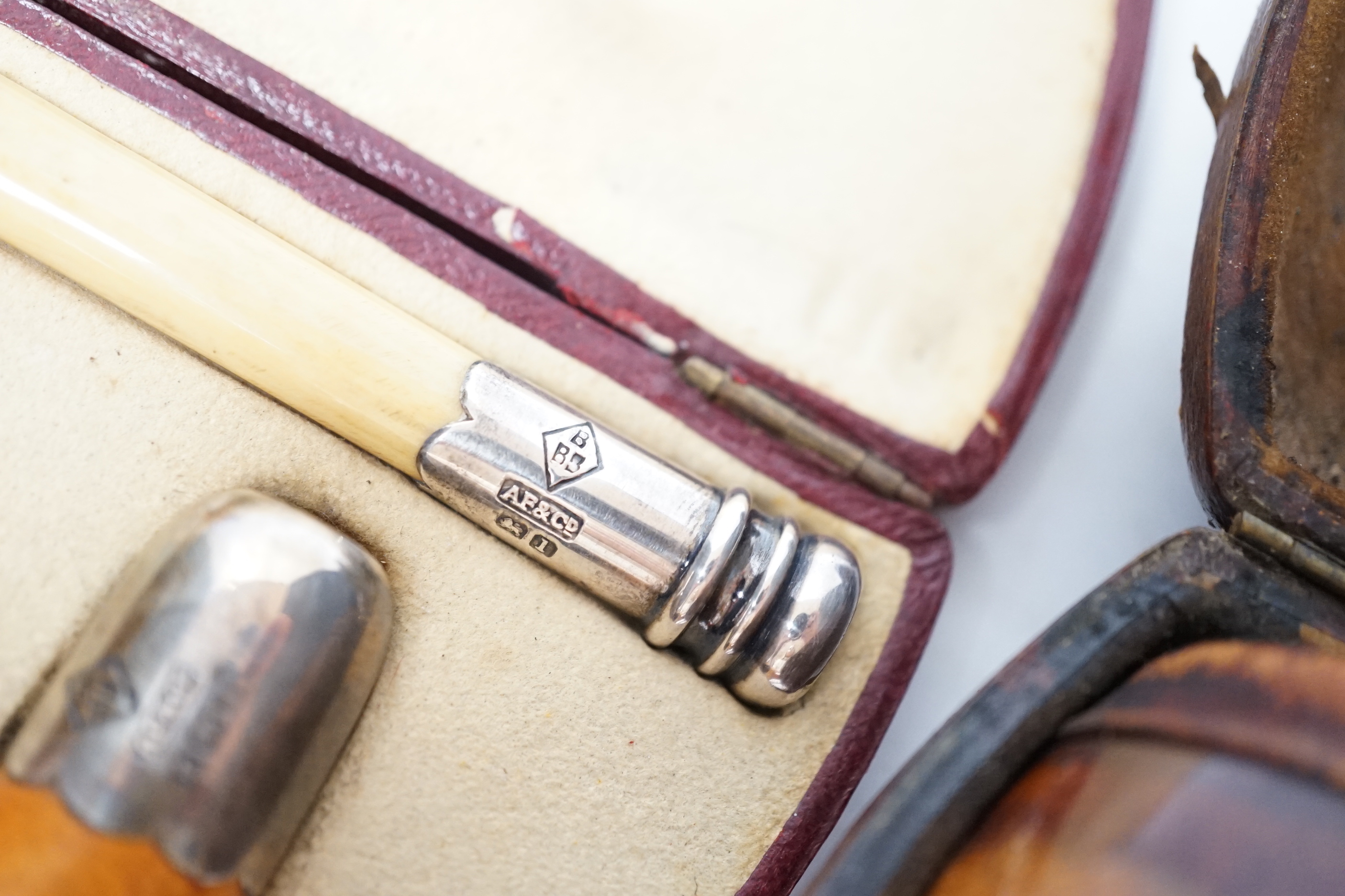 Three Meerschaum pipes, one 9ct gold mounted, one silver mounted, two cases